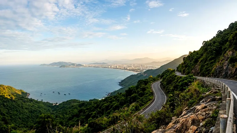 Hai Van Pass road winding along green cliffs above Da Nang Bay